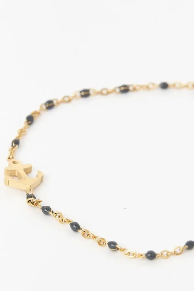Cargador Portátil Pulsera o brazalete color dorado con ancla, piedra azul.