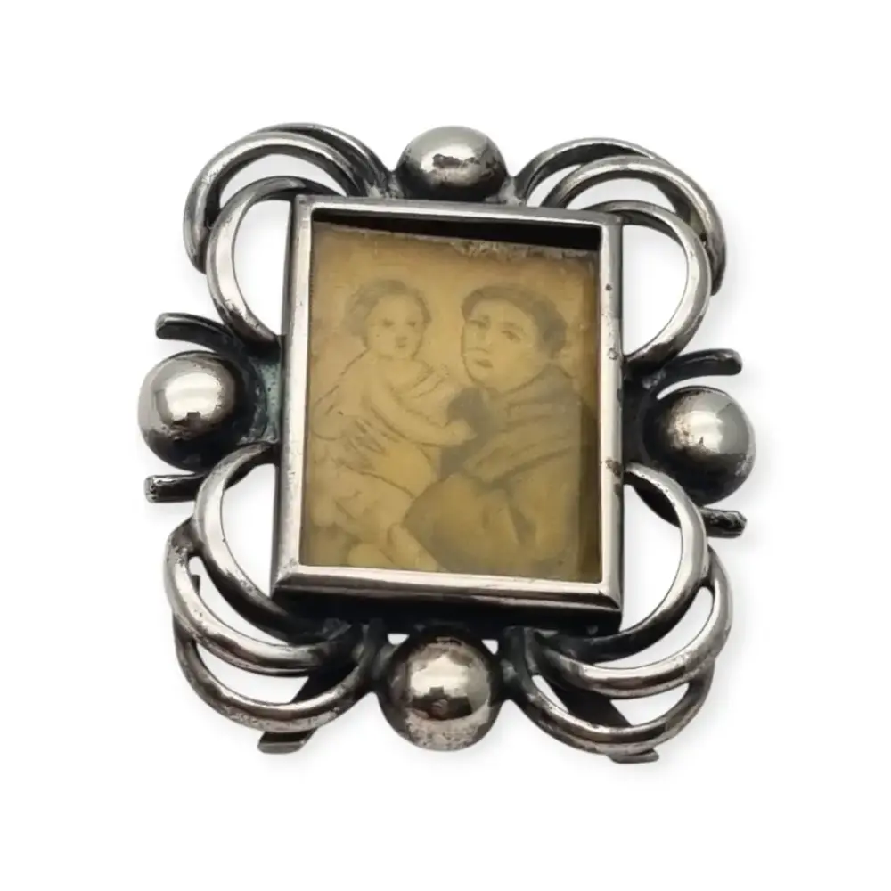 Marco de viaje en plata con imagen de San Antonio de Padua y Niño Jesús, devocional portátil siglo XX
